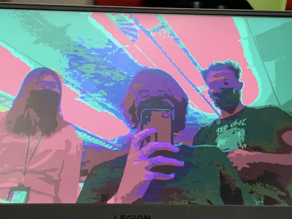 three people taking a selfie with a modified filter